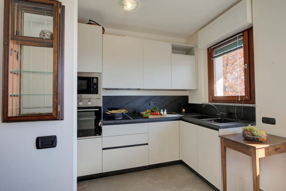 Standard Apartment, Multiple Bedrooms (Appartamento Residenza Chiara) | Private kitchen | Fridge, microwave, oven, stovetop