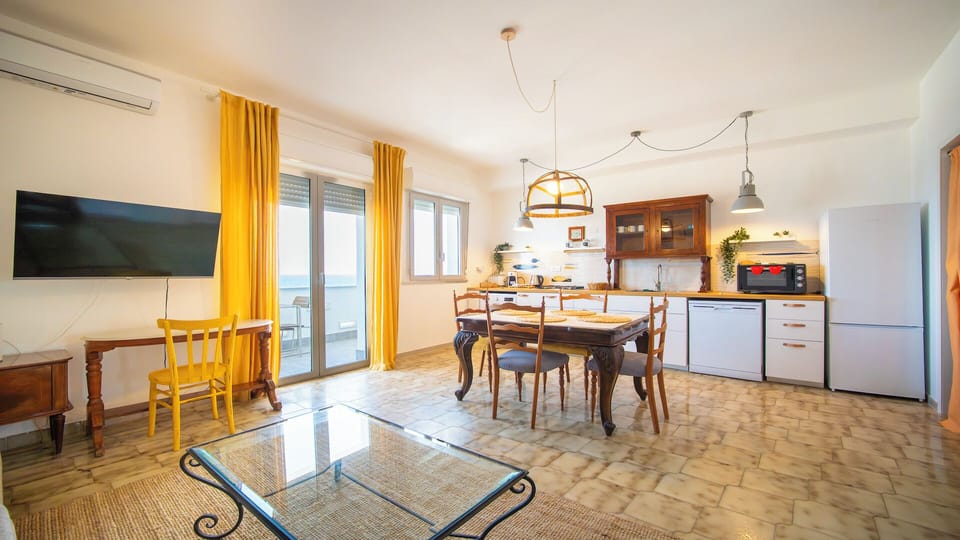 Apartment, Sea View | Living area | 32-inch flat-screen TV with cable channels