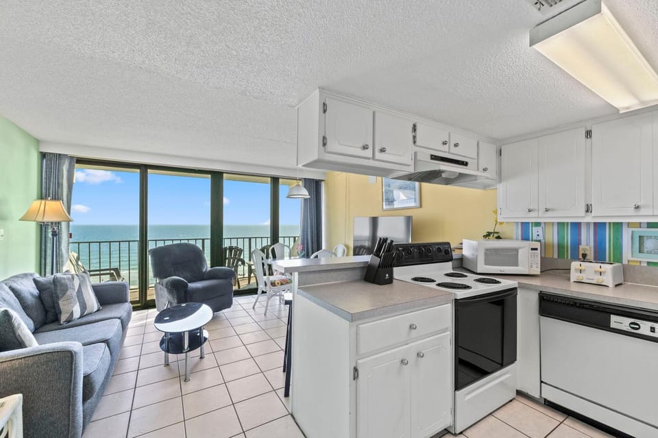 Condo, 1 King Bed with Sofa bed (Island Winds East Unit 704) | Private kitchen | Oven, toaster