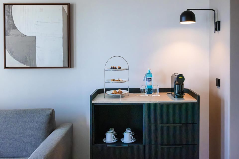 Suite (Skyline) | Living area | 50-inch Smart TV with cable channels, books