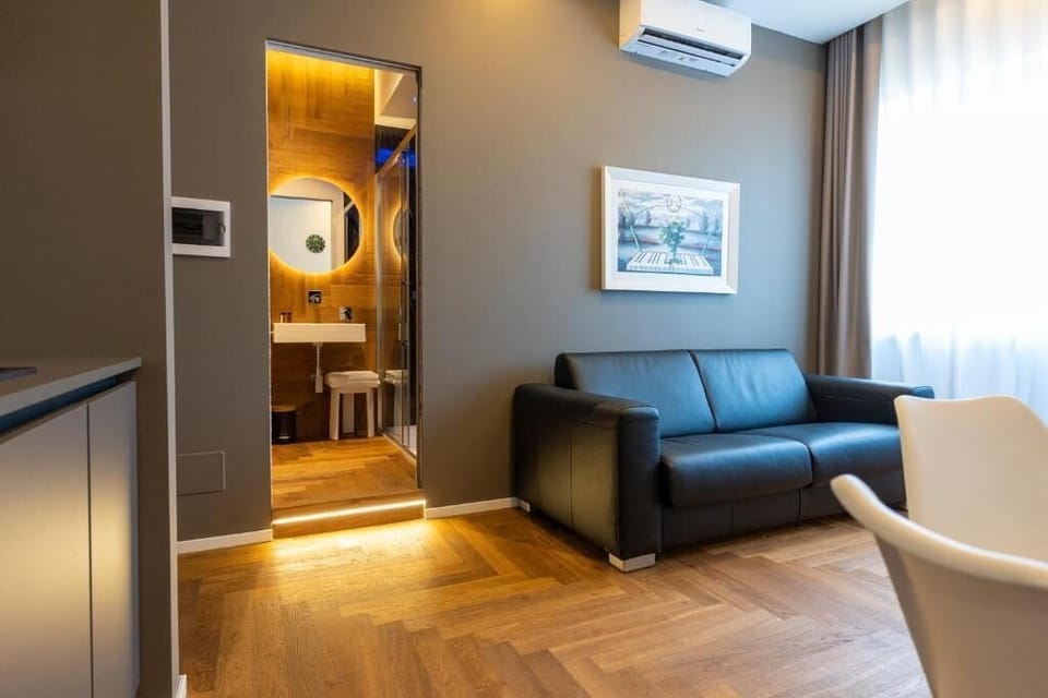 Suite, City View | Living area | TV, printers