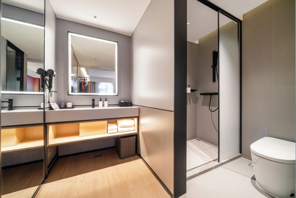 Shower, hydromassage showerhead, designer toiletries, hair dryer
