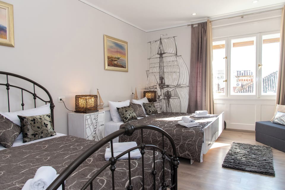 Deluxe Room, 2 Queen Beds, City View | In-room safe, iron/ironing board, free WiFi