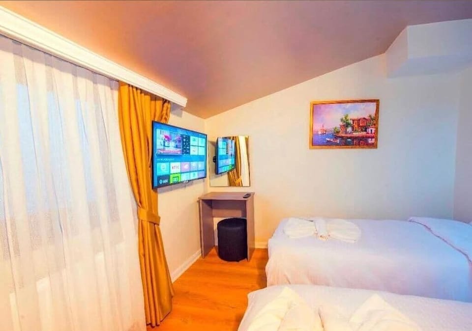 Standard Triple Room, City View | In-room safe, soundproofing, iron/ironing board (on request)