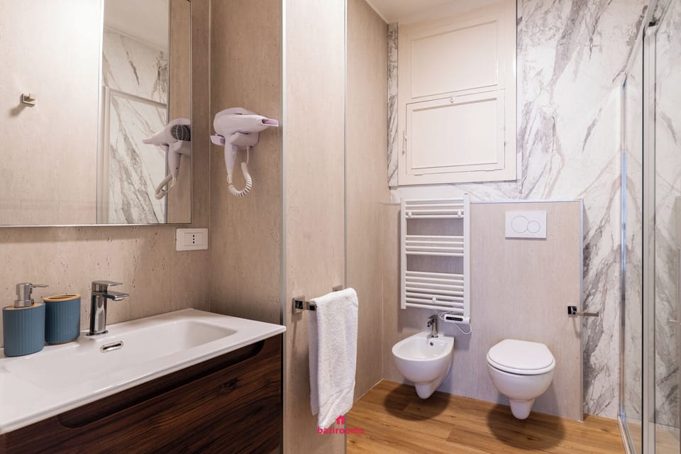 Quadruple Room | Bathroom | Shower, hair dryer, bidet, towels