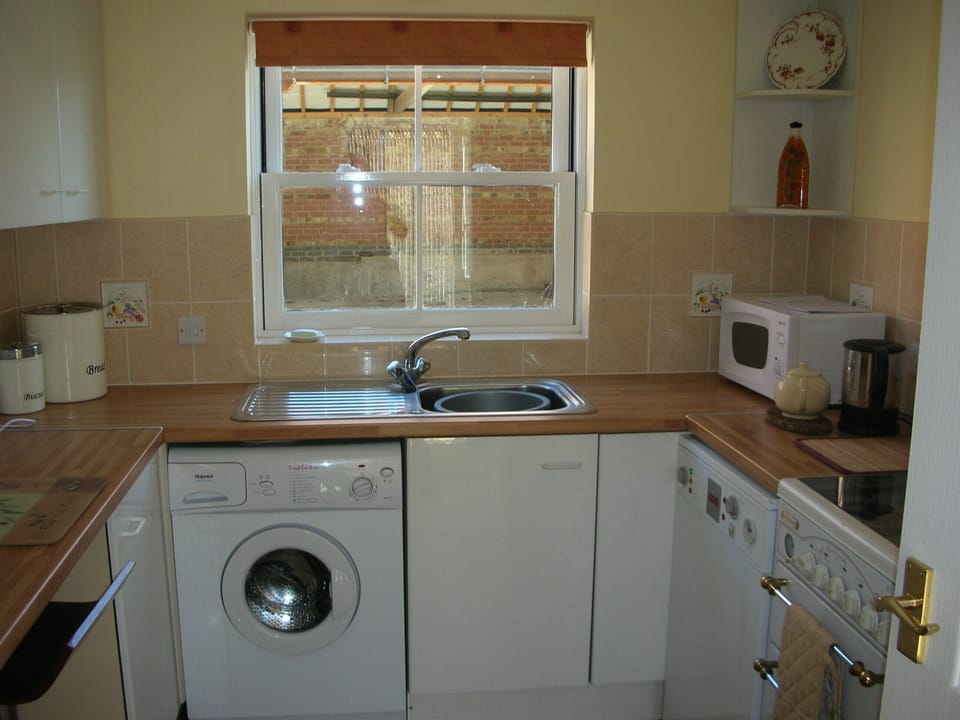 Standard Cottage, 2 Bedrooms | Private kitchen | Fridge, microwave, coffee/tea maker, electric kettle