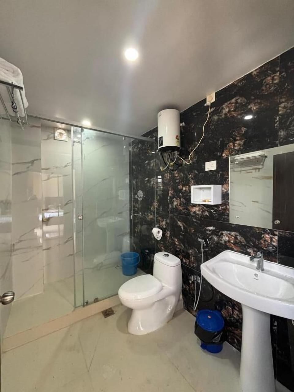 Shower, towels, soap, toilet paper