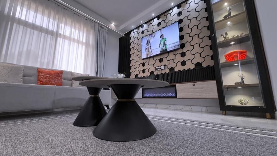 Comfort Apartment, Balcony, City View | Living area | 47-inch Smart TV with digital channels, fireplace