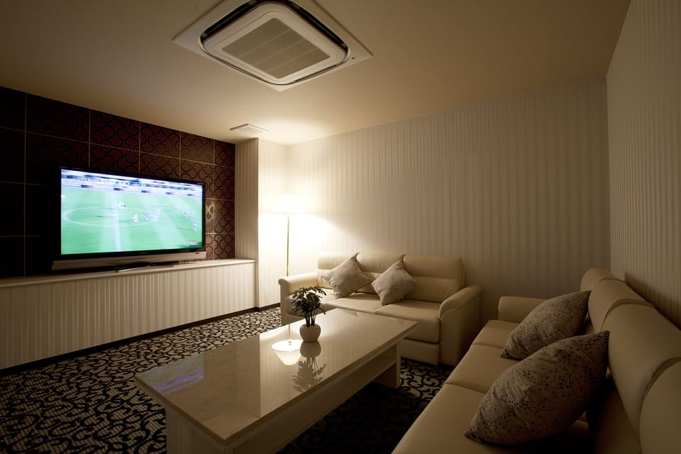 Suite | Living room | 50-inch flat-screen TV with digital channels, TV, video-game console