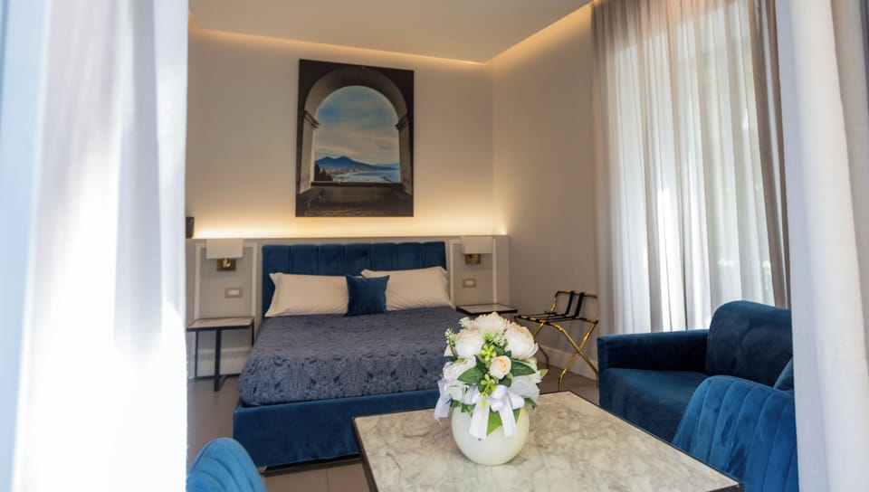 Deluxe Triple Room, Non Smoking, Balcony | In-room safe, desk, free WiFi