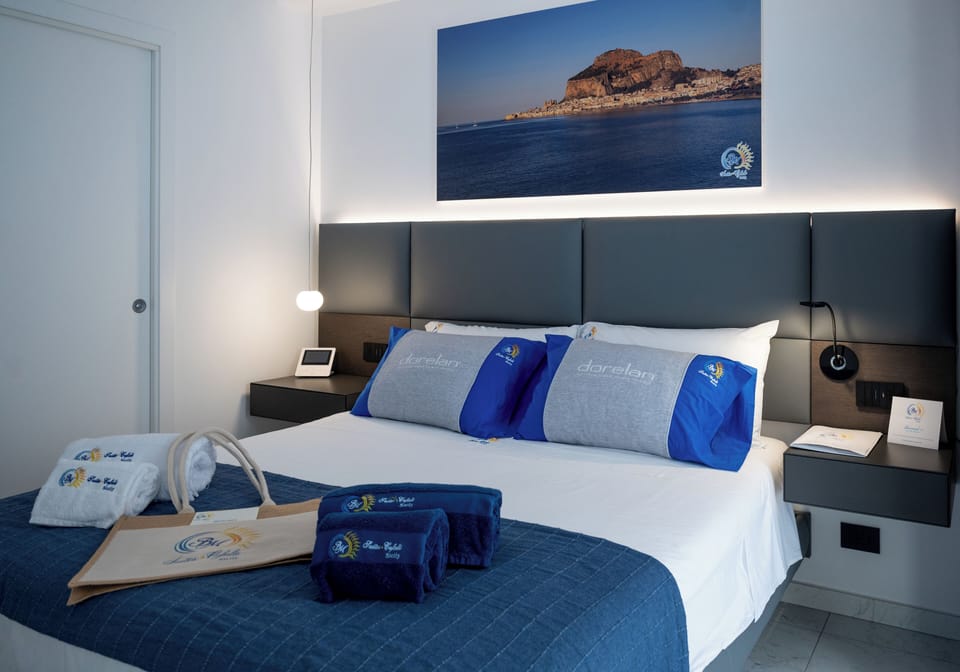 Deluxe Double Room, Patio, Courtyard View | In-room safe, blackout drapes, soundproofing, iron/ironing board