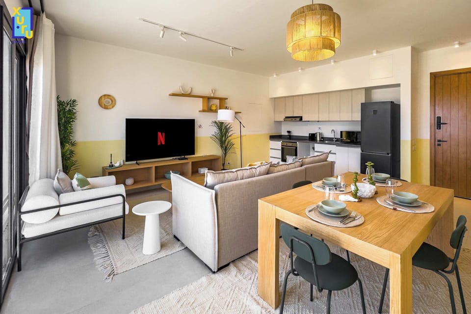 Basic Apartment | Living area | 55-inch TV with cable channels