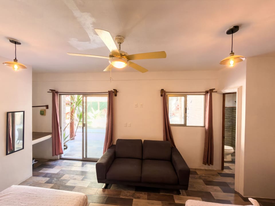 Deluxe Quadruple Room, Garden View | In-room safe, desk, laptop workspace, free WiFi