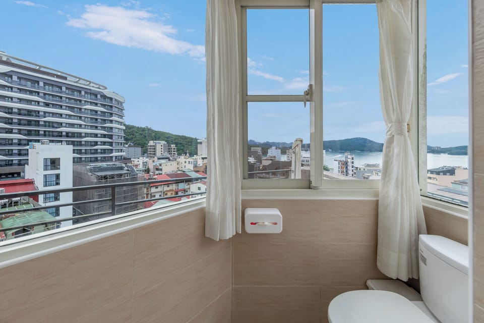 Family room with lake view | Bathroom | Hair dryer, slippers, towels, shampoo