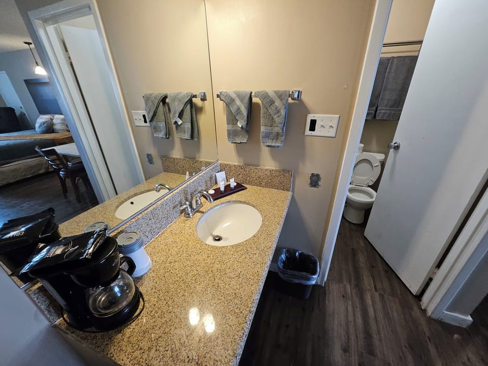Superior Studio Suite, Non Smoking, Refrigerator & Microwave | Bathroom | Combined shower/tub, eco-friendly toiletries, towels, soap