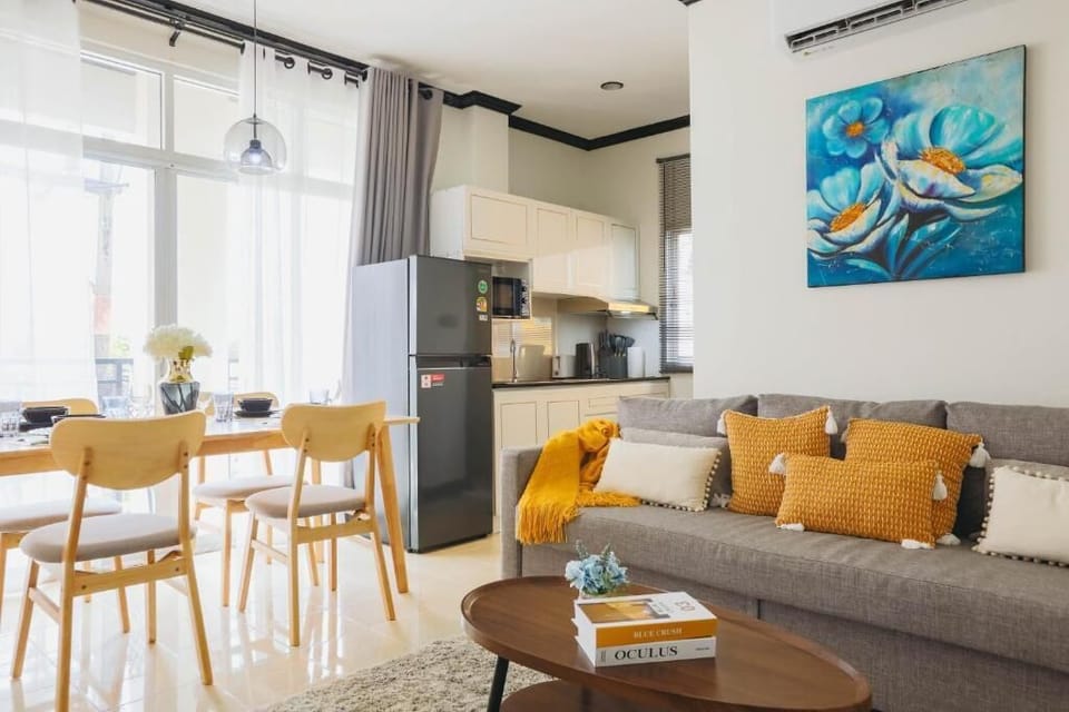 Apartment, 4 Bedrooms, Balcony, City View | Living area | Flat-screen TV