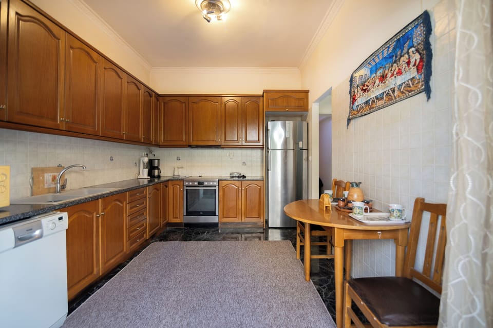 Classic Apartment, 3 Bedrooms, Courtyard View | Private kitchen | Shared fridge, microwave, coffee/tea maker, electric kettle