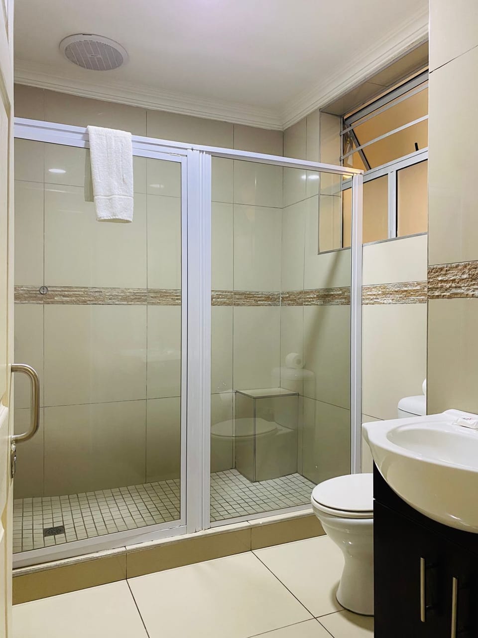 Shower, rainfall showerhead, towels, soap