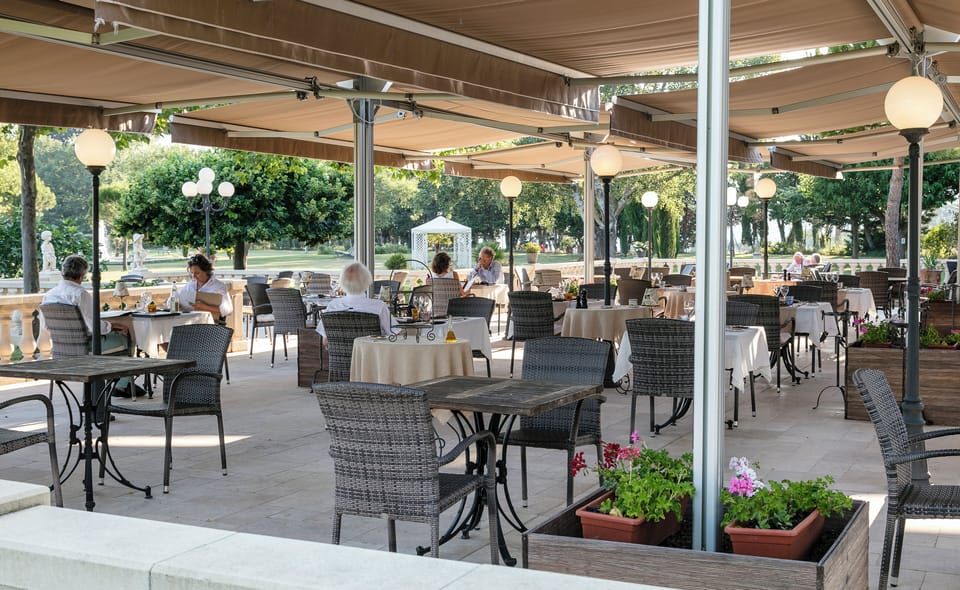 Lunch, dinner served; French cuisine, garden views 