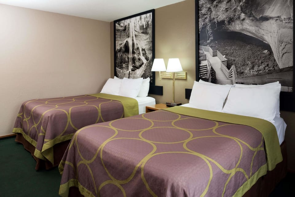 Desk, laptop workspace, iron/ironing board, free cribs/infant beds