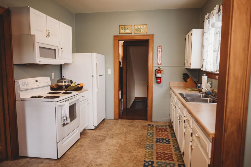 Townhouse 213 | Private kitchen | Full-size fridge, oven, stovetop, dishwasher