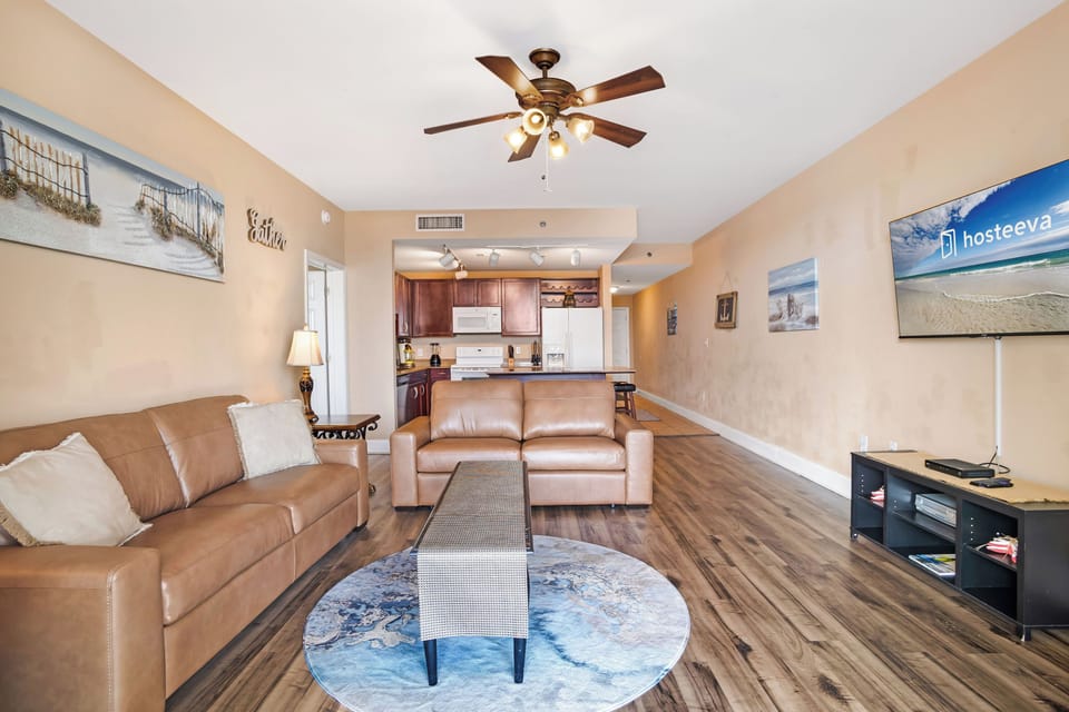Signature Condo, 2 Bedrooms, Balcony, Lake View | Living room | 32-inch Smart TV with cable channels