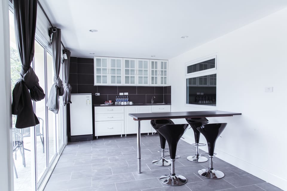 Premier Penthouse, 3 Bedrooms, Partial Sea View | Private kitchenette | Full-size fridge, coffee/tea maker, electric kettle, paper towels