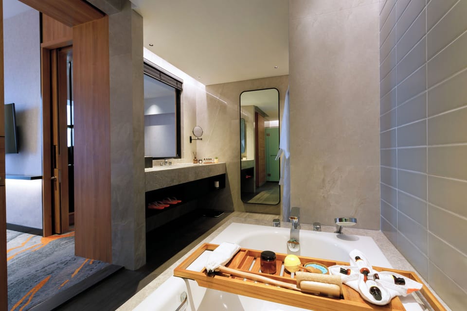 Harris Suite | Bathroom | Hair dryer, slippers, towels, soap