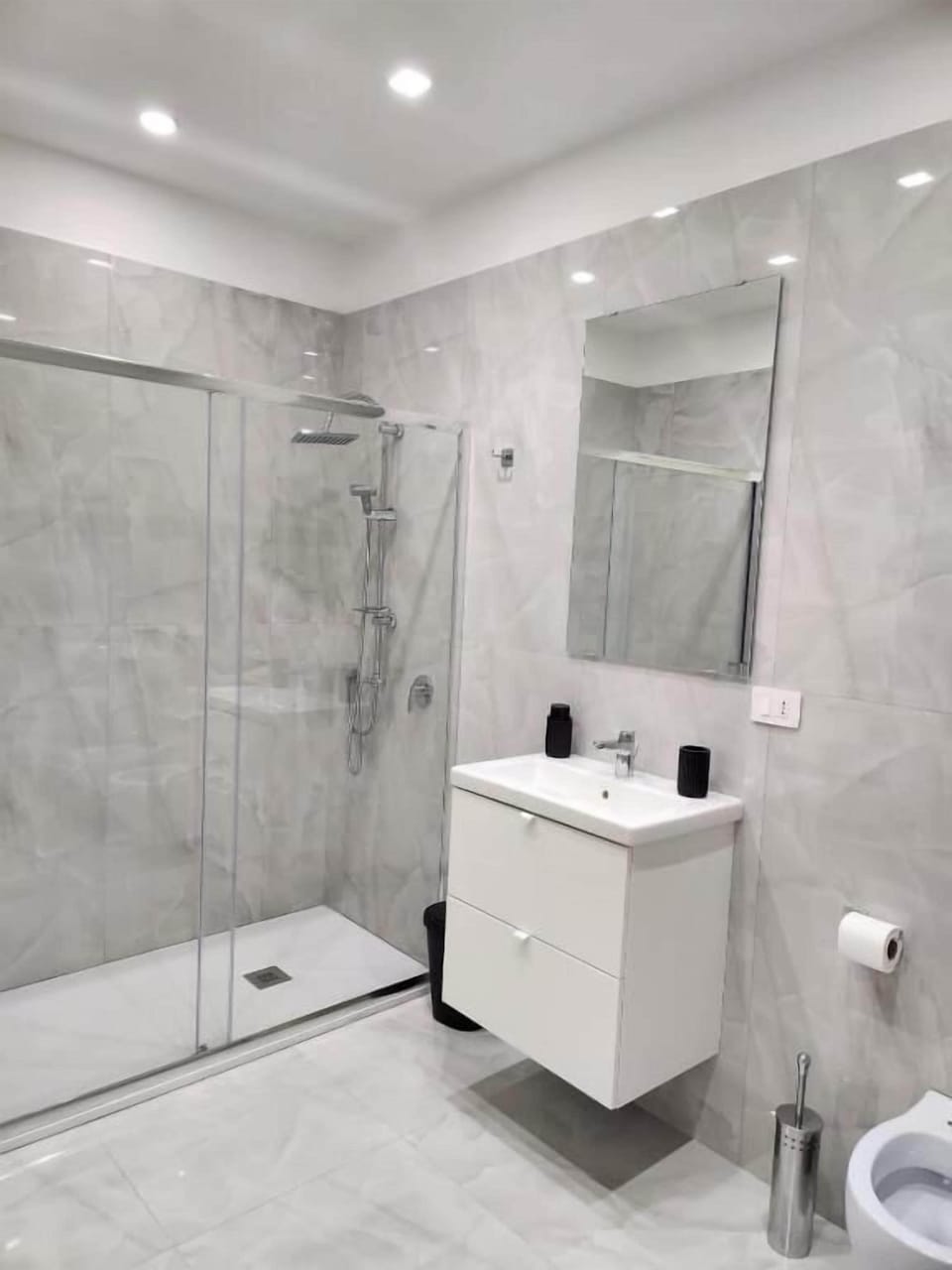 Shower, rainfall showerhead, hair dryer, towels