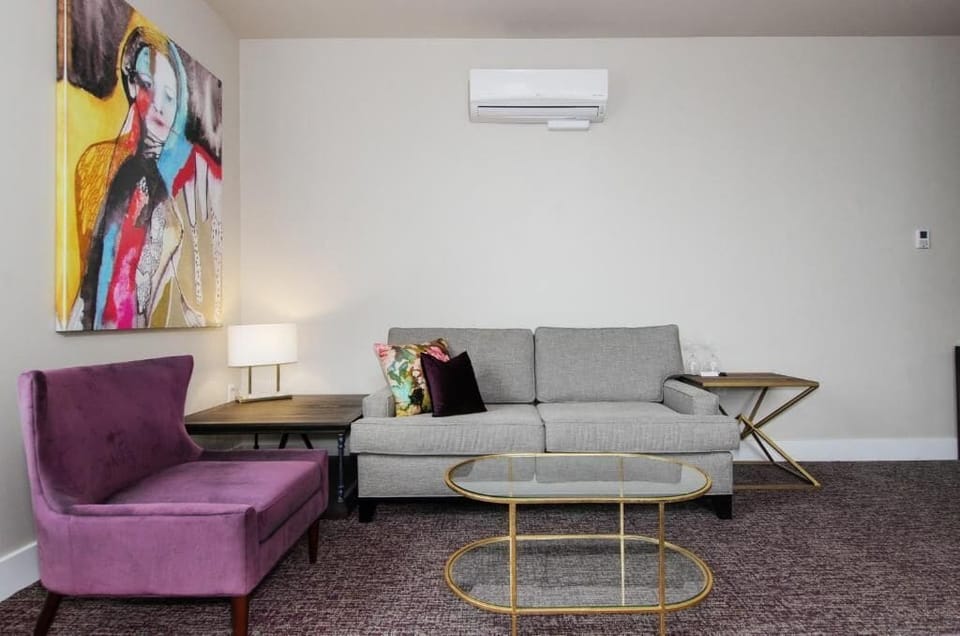 Junior King Suite | Living area | 55-inch TV with cable channels