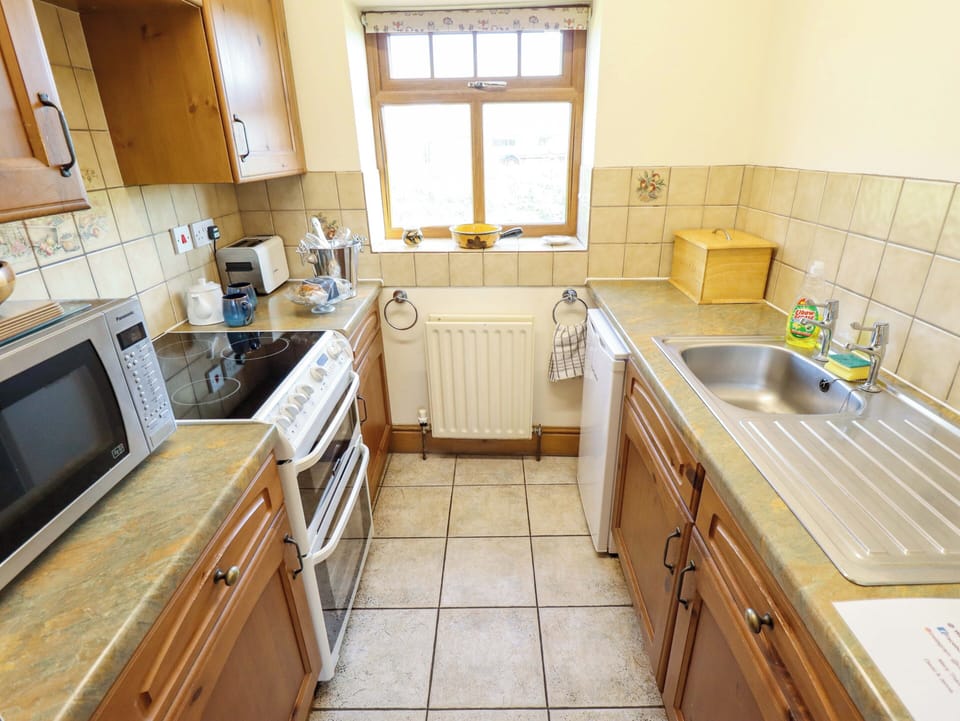 Fridge, microwave, toaster, cookware/dishes/utensils