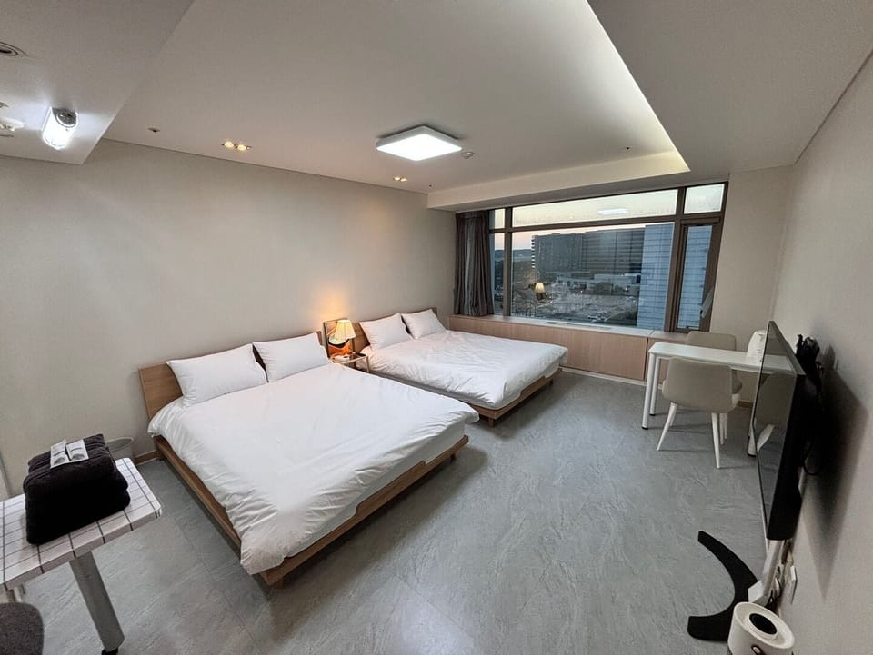 Standard Twin Room, City View | Desk, laptop workspace, blackout drapes, free WiFi