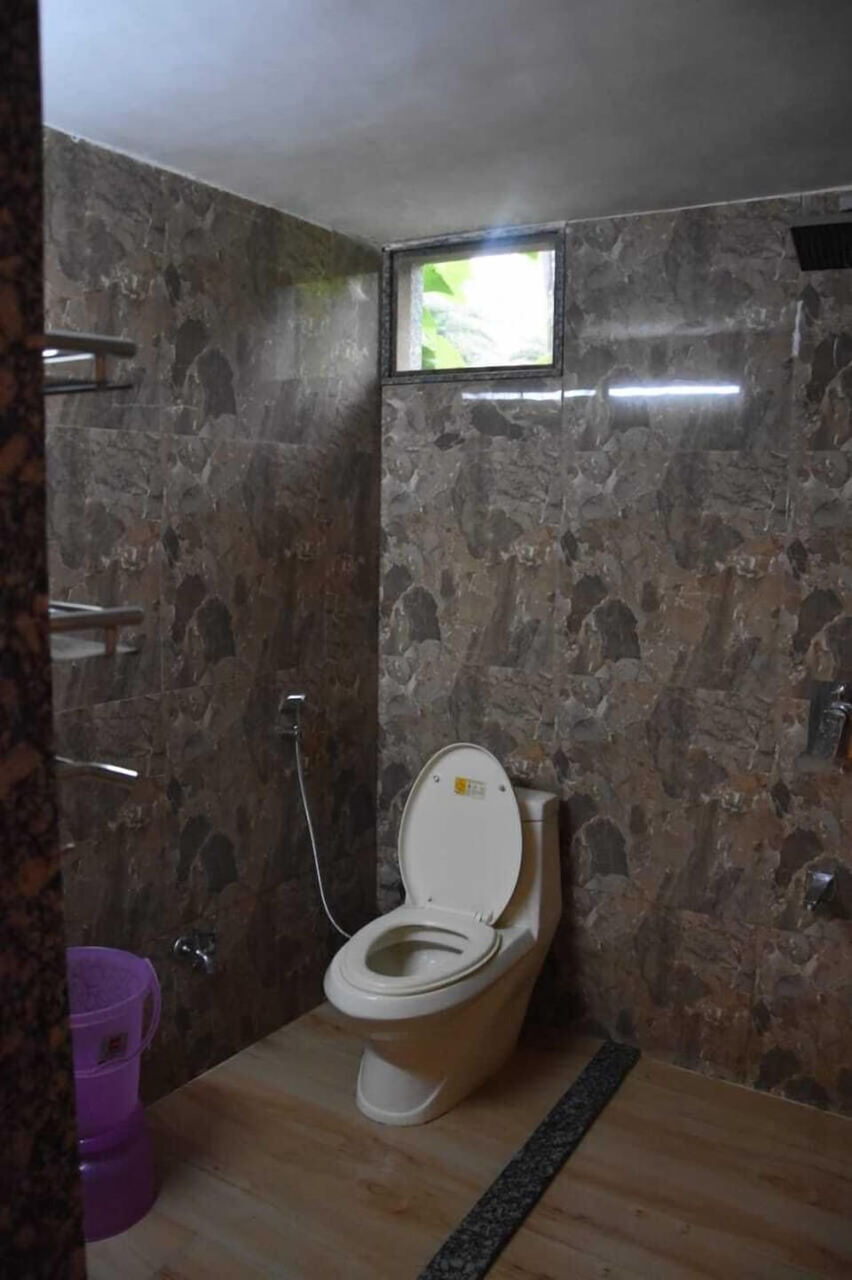 Shower, towels, shampoo, toilet paper
