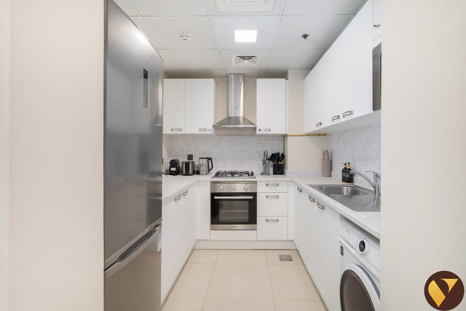 Luxury Apartment, Balcony, Pool View | Private kitchen | Full-size fridge, microwave, oven, stovetop