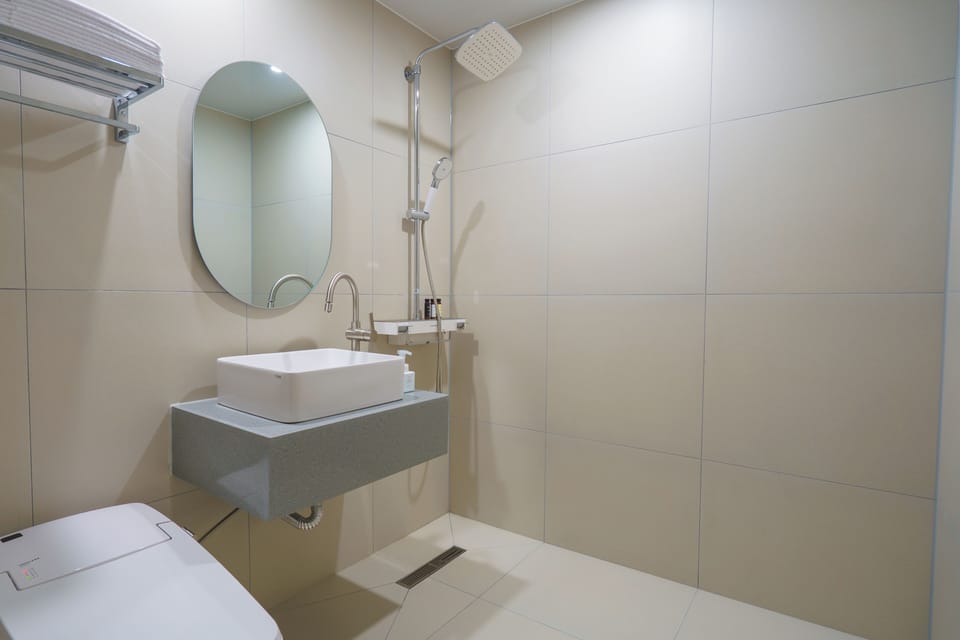 Shower, free toiletries, hair dryer, slippers