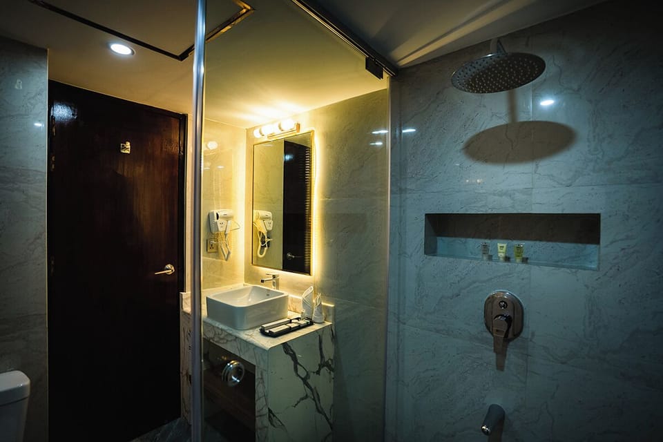 Shower, free toiletries, slippers, soap