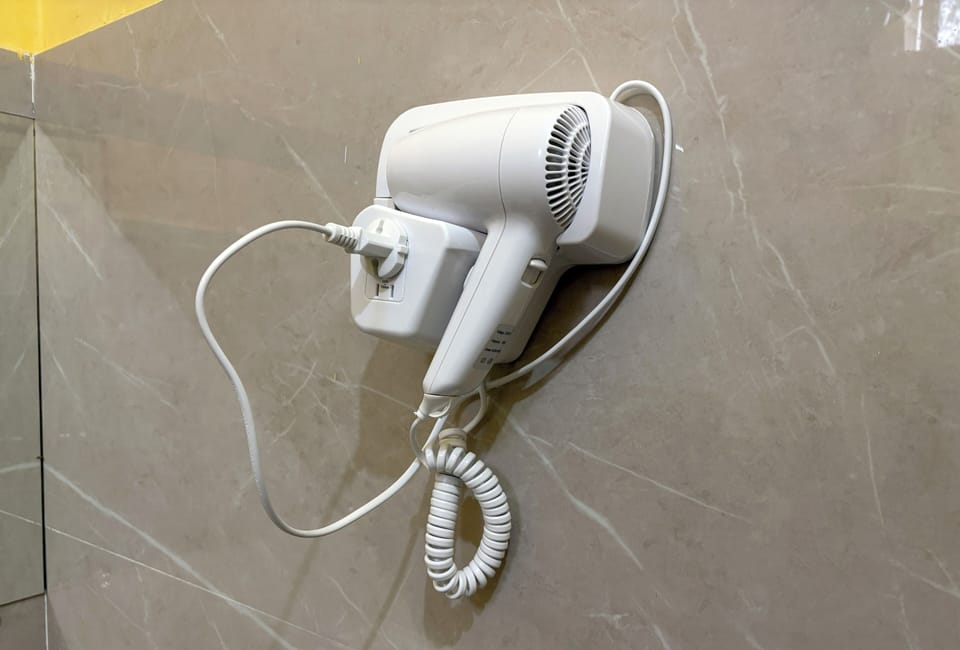 Shower, hair dryer, slippers, towels