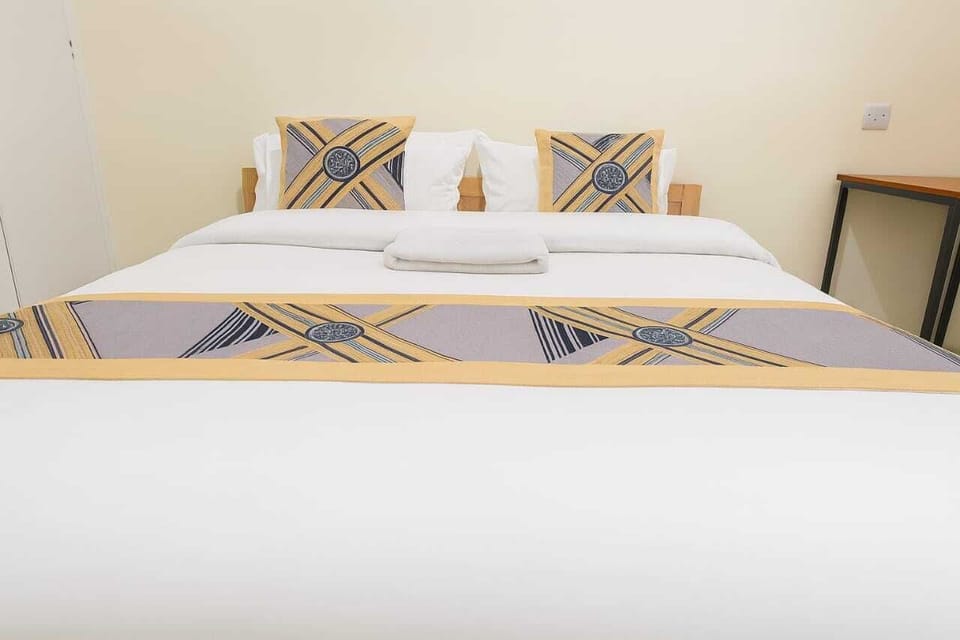 Deluxe Double Room, City View | Desk, laptop workspace, blackout drapes, iron/ironing board