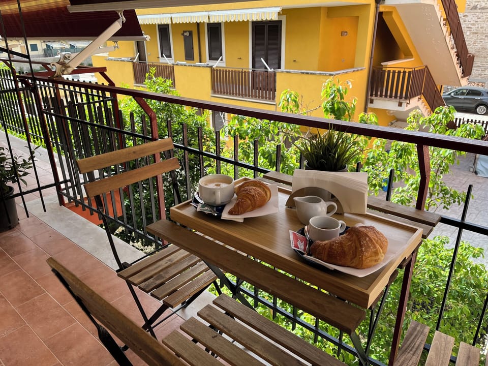 Deluxe Triple Room, Balcony, City View | Outdoor dining