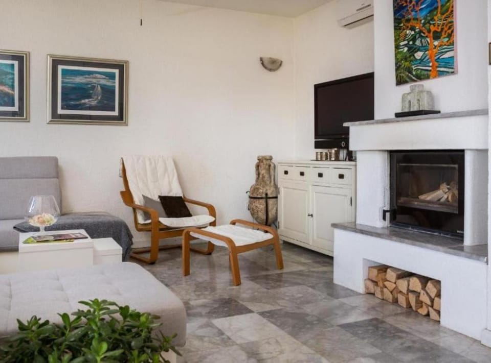 Villa (Seafront Six Bedroom Modern Villa wit) | Living room | 32-inch flat-screen TV with digital channels