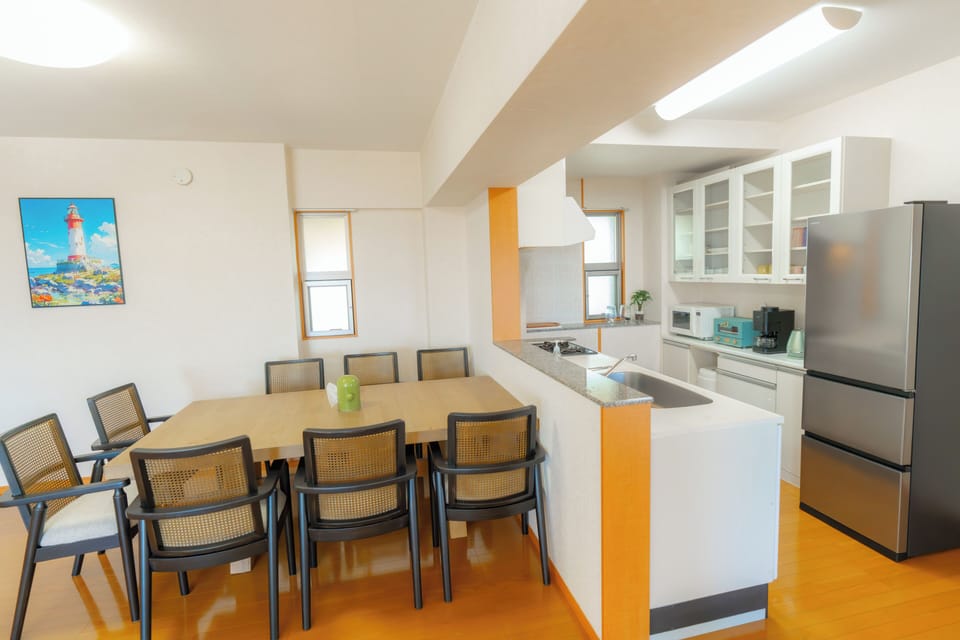 Elite Condo, Balcony, Ocean View | Private kitchen | Electric kettle, dining table