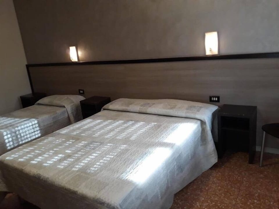 Classic Triple Room, Balcony, City View | Desk, laptop workspace, WiFi (free), bed sheets
