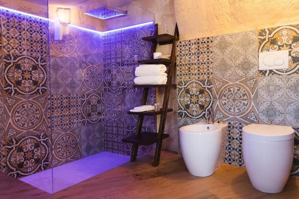 Deluxe Double Room, City View | Bathroom | Shower, free toiletries, hair dryer, slippers