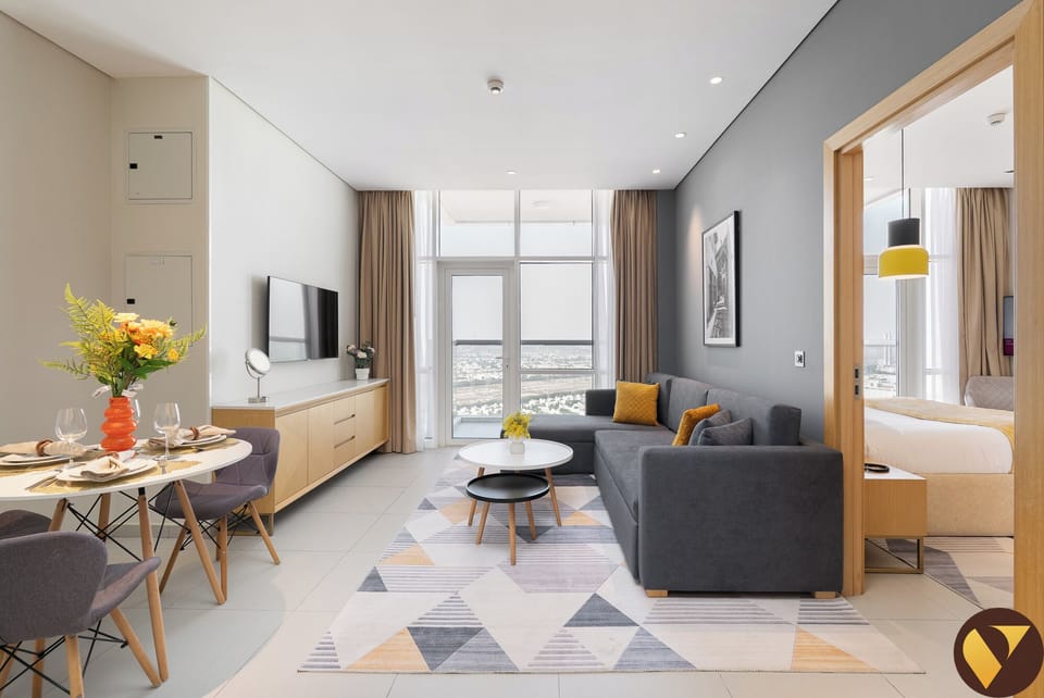 Luxury Apartment, Balcony, City View | Living area | 65-inch Smart TV with cable channels