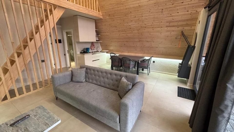 Deluxe Villa, Garden View | Living area | Flat-screen TV