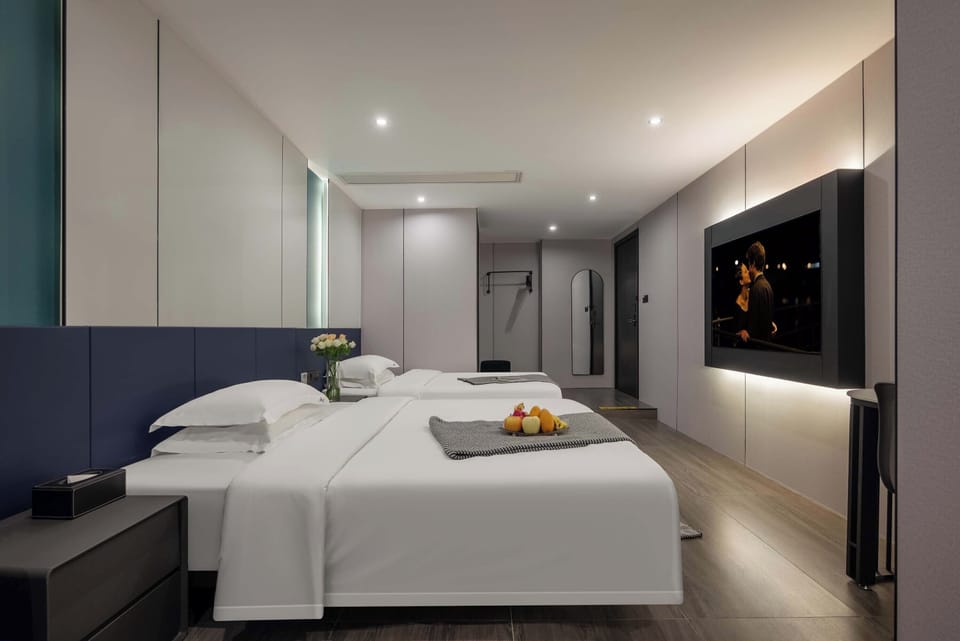 Family Suite, City View | Desk, blackout drapes, soundproofing, iron/ironing board