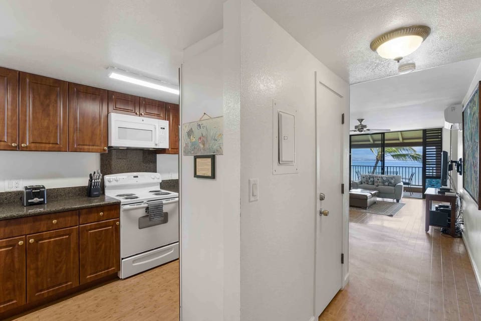 Condo, Multiple Beds, Balcony, Ocean View (Lauloa 410) | Private kitchen | Coffee/tea maker, dining tables