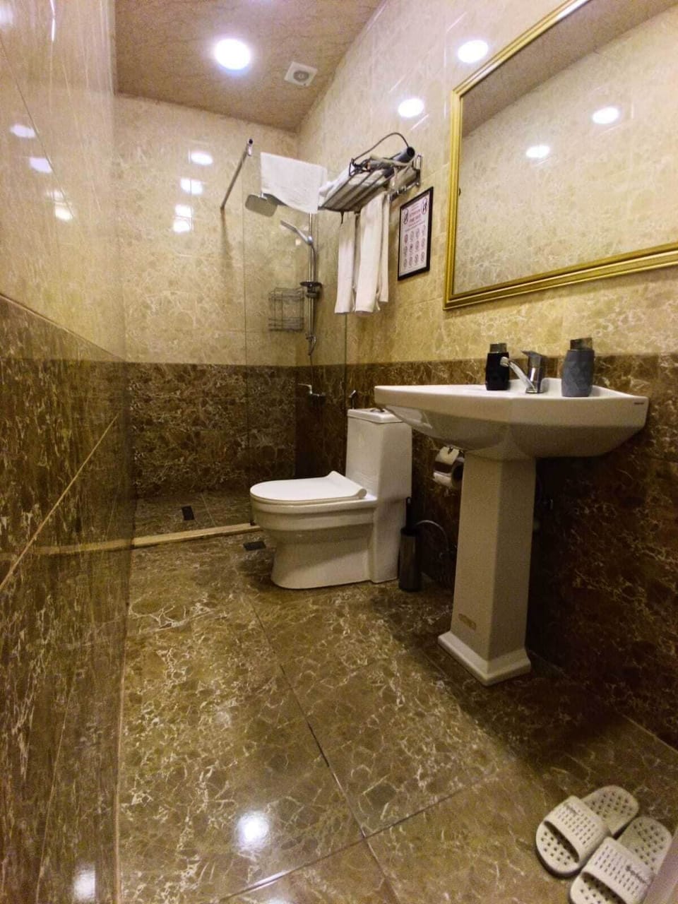 Hair dryer, slippers, towels, soap
