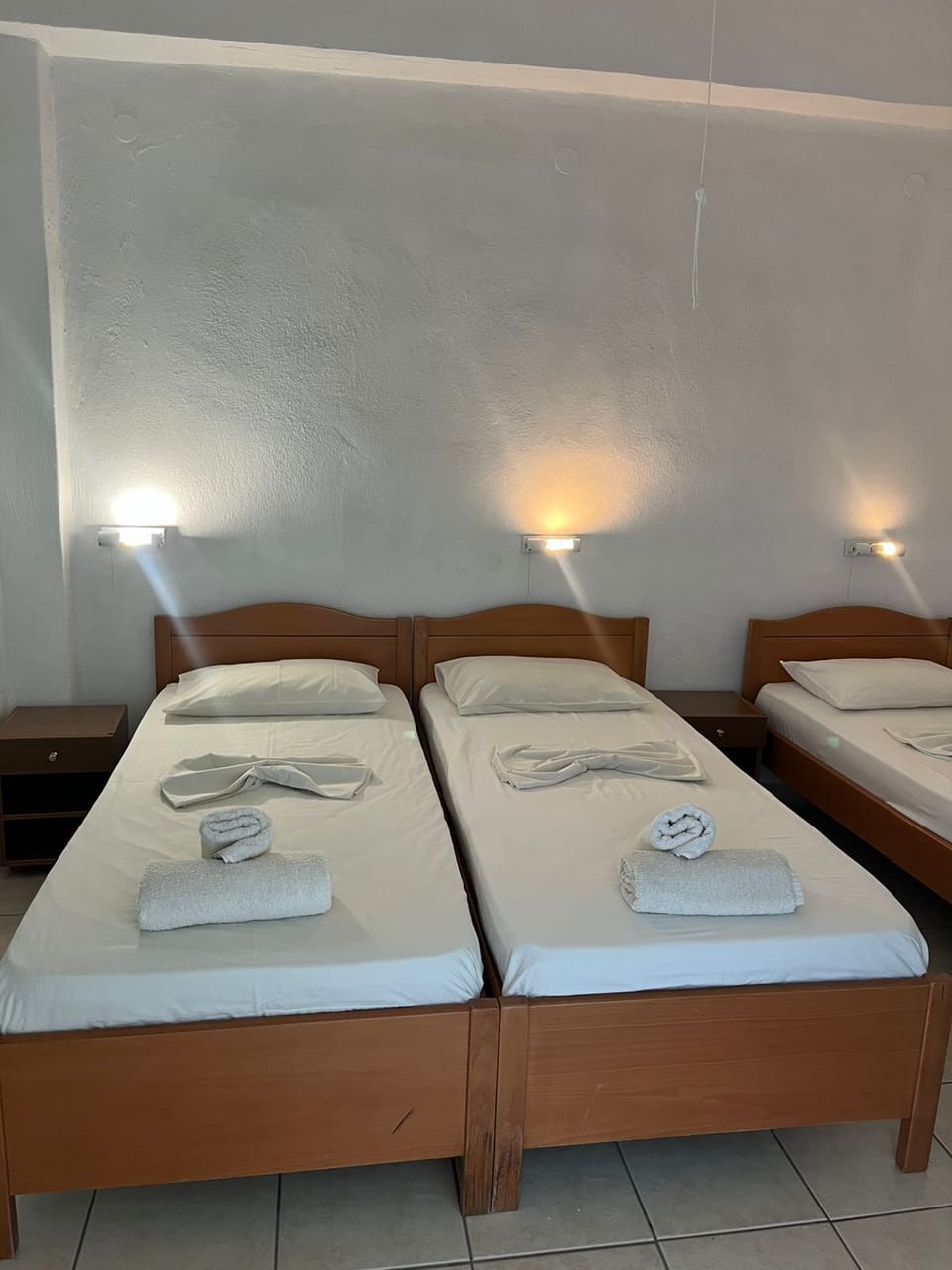 Standard Triple Room, Patio, Sea View | In-room safe, blackout drapes, free WiFi, bed sheets