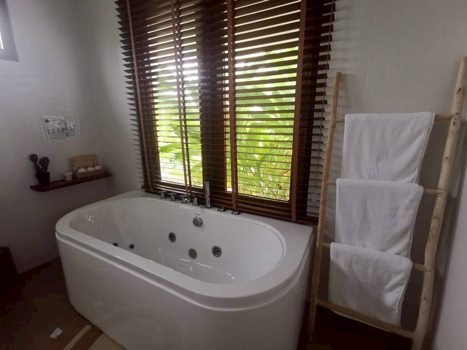 Baan Sook Jai | Bathroom | Shower, hair dryer, slippers, towels
